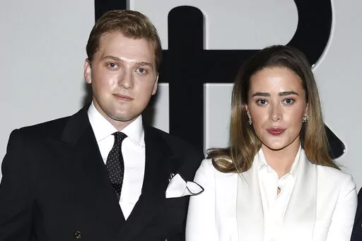 Naomi Biden, right, and fiancé Peter Neal attend the Ralph Lauren Fall/Winter 2022 fashion show at the Museum of Modern Art on Tuesday, March 22, 2022, in New York. Naomi Biden, the granddaughter of President Joe Biden, and Peter Neal are getting married on the South Lawn on Saturday in what will be the 19th wedding in White House history. (Photo by Evan Agostini/Invision/AP, File)