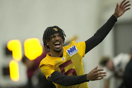Washington Commanders first round draft pick quarterback Jayden Daniels warms up during an NFL rookie minicamp football practice in Ashburn, Va., Friday, May 10, 2024. (AP Photo/Susan Walsh)