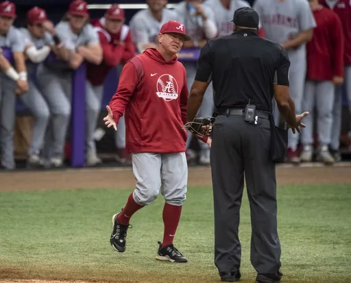 Alabama head coach Brad Bohannon, left, argues with umpire Joe Harris after being tossed from an NCAA college baseball game in the bottom of the second inning against LSU, Saturday, April 29, 2023, in Baton Rouge, La. Alabama is firing baseball coach Brad Bohannon after a report of suspicious bets involving his team, with the school saying he violated “the standards, duties and responsibilities expected of university employees.” The firing announced Thursday, May 4, came three days after a r