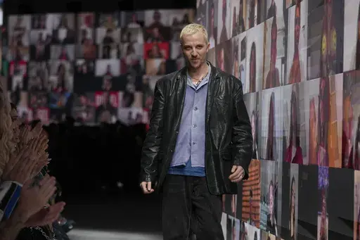 Diesel's creative director Glenn Martens receives the applause at the end of their women's Fall-Winter 2024-25 collection presented in Milan, northern Italy, Wednesday, Feb. 21, 2024. (AP Photo/Luca Bruno, File)