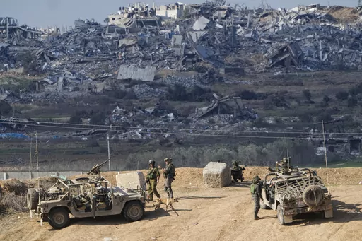 Israeli soldiers take up positions near the Gaza Strip border, in southern Israel, Friday, Dec. 29, 2023. The army is battling Palestinian militants across Gaza in the war ignited by Hamas' Oct. 7 attack into Israel. Israel and Hamas have been at war for 100 days. The war already is the longest and deadliest between Israel and the Palestinians since Israel’s establishment in 1948, and the fighting shows no signs of ending. (AP Photo/Ariel Schalit, File)