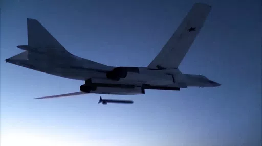 In this photo taken from a video distributed by Russian Defense Ministry Press Service, on Dec. 9, 2020, a Russian Tu-160 strategic bomber fires a cruise missile at test targets, during a military drills, Russia. The Russian Defense Ministry said that the military will hold drills involving tactical nuclear weapons – the first time such exercise was publicly announced by Moscow. (Russian Defense Ministry Press Service via AP, File)