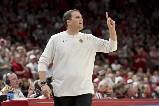Then-LSU coach Will Wade gestures during the first half of an NCAA college basketball game against Arkansas, Wednesday, March 2, 2022, in Fayetteville, Ark. An independent infractions panel handed a two-year show-cause penalty and a 10-game suspension to former LSU and current McNeese State men's basketball coach Will Wade on Thursday, June 22, 2023, for multiple rules violations. (AP Photo/Michael Woods, File)