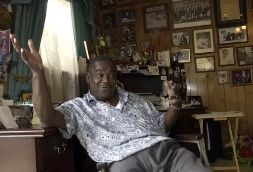 Clarence "Frogman" Henry gestures during an interview at his home in Algiers, La., June 12, 2003. Henry, one of New Orleans’ best known old-time R&B singers who scored a hit at age 19 with “Ain't Got No Home" in 1956, has died at age 87. (AP Photo/Bill Haber, File)