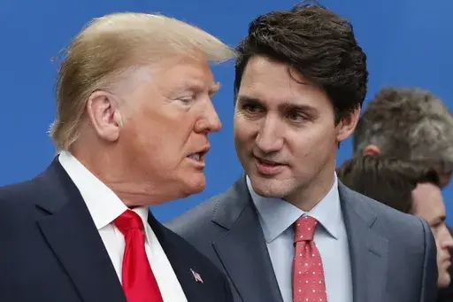 U.S. President Donald Trump, left, and Canadian Prime Minister Justin Trudeau talk prior to a NATO round table meeting at The Grove hotel and resort in Watford, Hertfordshire, England, Dec. 4, 2019. (AP Photo/Frank Augstein, File)