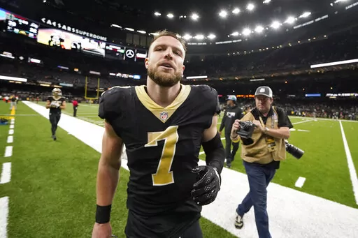 New Orleans Saints' Taysom Hill leaves the field after the team's 39-32 win over the Seattle Seahawks in an NFL football game in New Orleans, Sunday, Oct. 9, 2022. (AP Photo/Gerald Herbert)