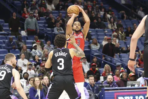 New Orleans Pelicans guard CJ McCollum (3) shoots a jumper over Utah Jazz guard Keyonte George (3) in the second half of an NBA basketball game in New Orleans, Monday, Jan. 20, 2025. (AP Photo/Peter Forest)