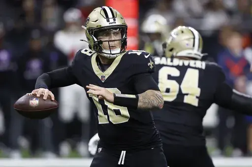 New Orleans Saints quarterback Spencer Rattler passes against the Tampa Bay Buccaneers during the second half of an NFL football game in New Orleans, Sunday, Oct. 13, 2024. (AP Photo/Butch Dill)