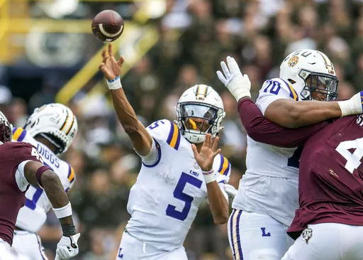 LSU quarterback Jayden Daniels (5) throws during an NCAA college football game against Texas A&M in Baton Rouge, La., Saturday, Nov. 25, 2023. (Scott Clause/The Daily Advertiser via AP)
