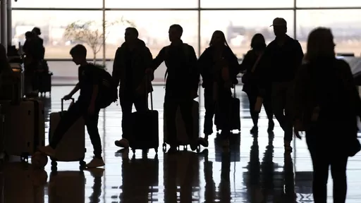 People pass through Salt Lake City International Airport Wednesday, Jan. 11, 2023, in Salt Lake City. Artificial intelligence chatbots like ChatGPT offer a novel way to research travel plans. They provide clear, easy-to-read suggestions that can be customized to almost any personal preference, leading to off-the-beaten-path suggestions that no guidebook or web search could provide. (AP Photo/Rick Bowmer, File)