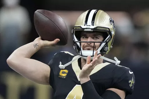 New Orleans Saints quarterback Derek Carr (4) throws a pass during warmups ahead of an NFL football game against the Tampa Bay Buccaneers, in New Orleans, Sunday, Oct. 1, 2023. (AP Photo/Gerald Herbert)