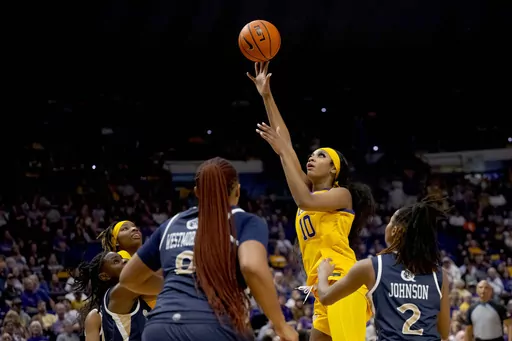 LSU forward Angel Reese (10) shoots against Queens guard Alexandria Johnson (2) during the first half of an NCAA college basketball game Thursday, Nov. 9, 2023, in Baton Rouge, La. (AP Photo/Matthew Hinton)