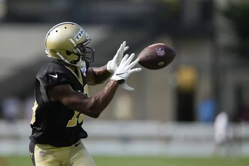 New Orleans Saints wide receiver Michael Thomas catches during drills at the NFL team's football training camp in Metairie, La., Tuesday, Aug. 1, 2023. (AP Photo/Gerald Herbert)