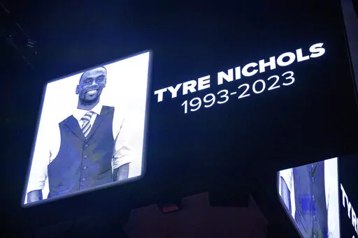 The screen at the Smoothie King Center in New Orleans honors Tyre Nichols before an NBA basketball game between the New Orleans Pelicans and the Washington Wizards, Jan. 28, 2023. Five former Memphis, Tenn., police officers were scheduled Friday, Feb. 17, to make their first court appearance on murder and other charges in the violent arrest and death of Nichols. (AP Photo/Matthew Hinton, File)