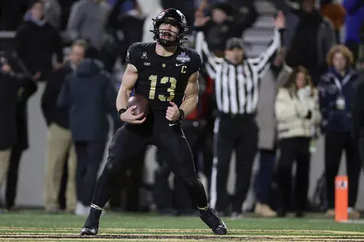 Army quarterback Bryson Daily (13) reacts after scoring a touchdown during the first half of the American Athletic Conference championship NCAA college football game against Tulane Friday, Dec. 6, 2024, in West Point, N.Y. (AP Photo/Adam Hunger)