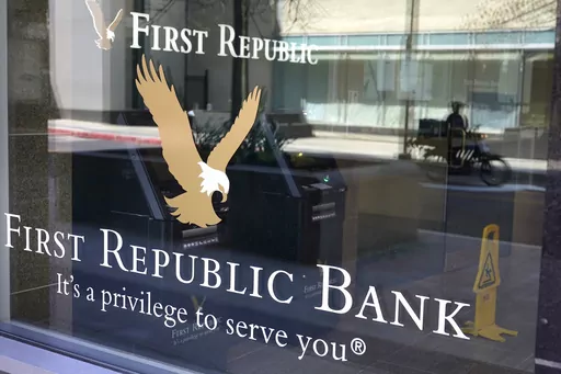 First Republic Bank signs and logos are attached to a window at a branch location, Wednesday, April 26, 2023, in Boston. Regulators seized troubled First Republic Bank early Monday and sold all of its deposits and most of its assets to JPMorgan Chase Bank in a bid to head off further banking turmoil in the U.S. (AP Photo/Steven Senne, File)