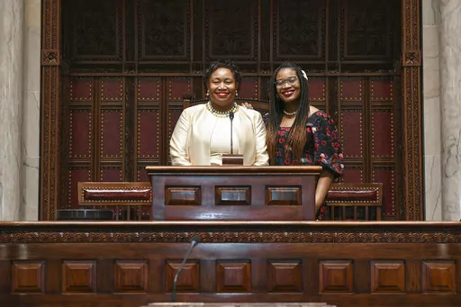 Judge Shirley Troutman stands with her daughter, Lauren Howard, in the New York Senate Chamber in Albany, N.Y., Jan. 12, 2022.  Troutman is among 17 Black women and 14 Black men currently serving on their state's highest court, according to the Brennan Center for Justice in New York, which has tracked diversity on those courts. (N.Y. State Senate via AP, File)
