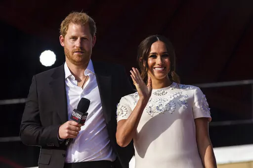Prince Harry and his wife Meghan speak during the Global Citizen festival, on Sept. 25, 2021 in New York. Prince Harry and his wife Meghan have visited Queen Elizabeth II at Windsor Castle on their first joint visit to the U.K. since they gave up formal royal roles and moved to the U.S. more than two years ago. The couple’s office says they visited the 95-year-old queen, Harry’s grandmother, Thursday, April 14, 2022 on their way to the Netherlands to attend the Invictus Games (AP Photo/Stefa