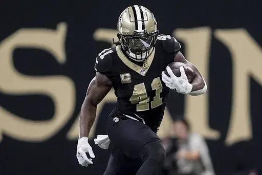 New Orleans Saints running back Alvin Kamara (41) runs against the Atlanta Falcons during the second half of an NFL football game, Sunday, Nov. 10, 2024, in New Orleans. (AP Photo/Gerald Herbert)