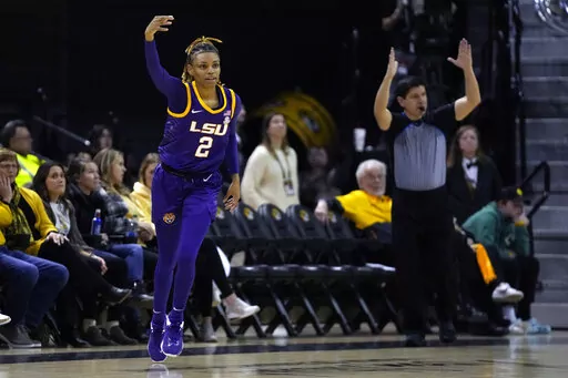 LSU's Jasmine Carson (2) celebrates after making a 3-point basket during the first half of an NCAA college basketball game against Missouri Thursday, Jan. 12, 2023, in Columbia, Mo. (AP Photo/Jeff Roberson)