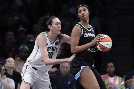 New York Liberty's Breanna Stewart (30) defends against Chicago Sky's Angel Reese (5) during the first half of a WNBA basketball game Thursday, May 23, 2024, in New York. (AP Photo/Frank Franklin II)