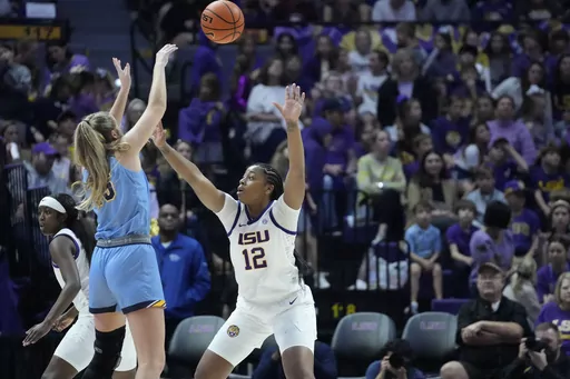 Kent State forward Bridget Dunn shoots against LSU guard Mikaylah Williams (12) in the second half an NCAA college basketball game in Baton Rouge, La., Tuesday, Nov. 14, 2023. LSU won 109-79. (AP Photo/Gerald Herbert)