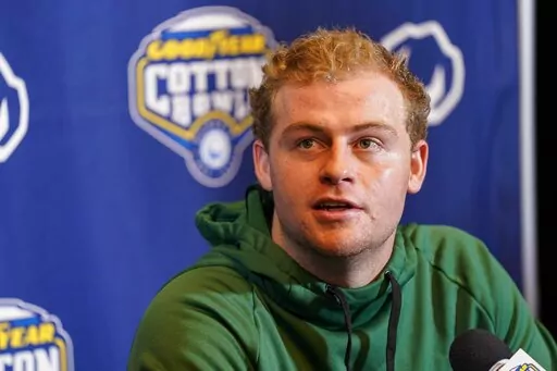 Tulane quarterback Michael Pratt (7) speaks during a news conference for the Cotton Bowl NCAA college football game, Thursday, Dec. 29, 2022, in Arlington, Texas. Tulane faces Southern California in the Cotton Bowl on Monday, Jan. 2, 2023. (AP Photo/Sam Hodde)