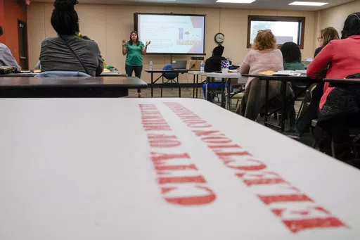 Claire Woodall executive director of the City of Milwaukee Election Commission, teaches a class to poll workers Saturday, Oct. 22, 2022, in Milwaukee. On Friday, May 17, 2024 The Associated Press reported on stories circulating online incorrectly claiming the Milwaukee Election Commission Executive Director was fired in recent days for her role in rigging the 2020 presidential election.(AP Photo/Morry Gash, File)