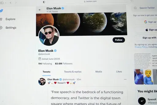 The Twitter page of Elon Musk is seen on the screen of a computer in Sausalito, Calif., on Monday, April 25, 2022.  Elon Musk wants to change how Twitter doles out its checkmark badges for verified accounts. While the “blue check” is at times viewed as an elite status symbol for the rich and famous, its purpose has always been to ensure that the people and accounts tweeting are who they say they are. (AP Photo/Eric Risberg, File)