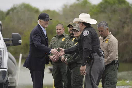 President Joe Biden talks with the U.S. Border Patrol and local officials, as he looks over the southern border, Feb. 29, 2024, in Brownsville, Texas, along the Rio Grande. (AP Photo/Evan Vucci, File)