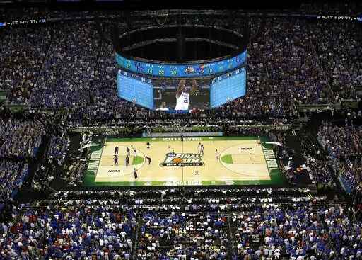 Kentucky and Kansas play in the NCAA college basketball Final Four championship game at the Superdome in New Orleans, Monday, April 2, 2012. Expect the NCAA Men's Final Four to have a more familiar look and feel to it this spring — and not just because it'll be in New Orleans for a record sixth time. A capacity crowd of about 70,000 in the Superdome for the games themselves is only the beginning. (AP Photo/David J. Phillip, File)