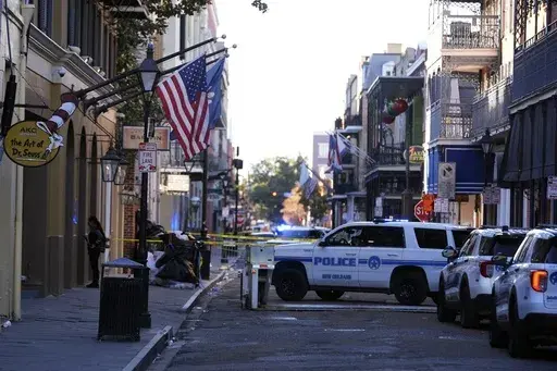 Emergency service vehicles form a security barrier to keep other vehicles out of the French Quarter after a vehicle drove into a crowd on New Orleans' Canal and Bourbon Street, Wednesday Jan. 1, 2025. (AP Photo/Gerald Herbert, File)