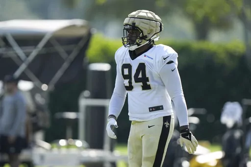 New Orleans Saints defensive end Cameron Jordan (94) walks between drills at the NFL team's football training camp in Metairie, La., Tuesday, Aug. 1, 2023. (AP Photo/Gerald Herbert)