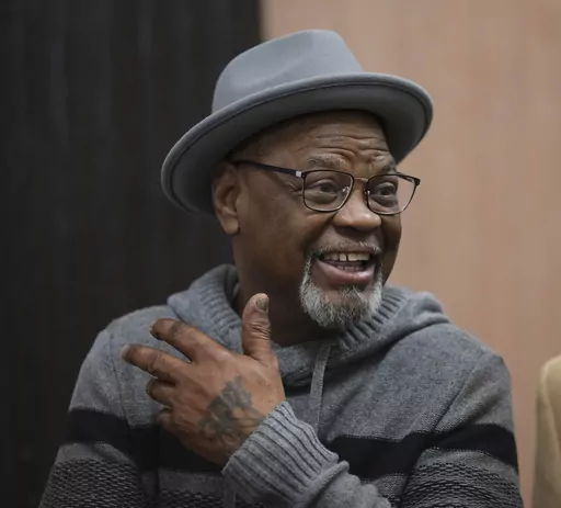 Glynn Simmons reacts after stepping out of the courthouse after Judge Amy Palumbo ruled to approve his "actual innocence" claim during a hearing at the Oklahoma County Courthouse Tuesday, Dec. 19, 2023, in Oklahoma City, Okla. (Doug Hoke/The Oklahoman via AP)