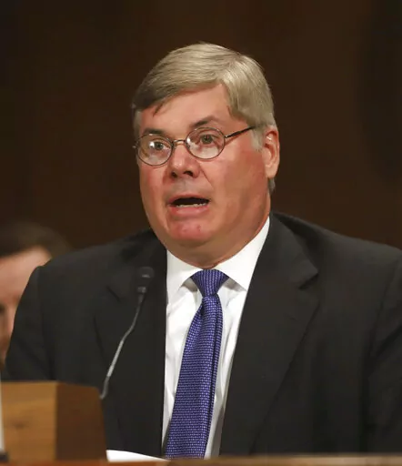 FILE -Robert R. Summerhays, President Donald Trump's nominee for District Judge for the Western District of Louisiana gives testimony during a U. S. Senate Judiciary Committee Hearing on Capitol Hill in Washington on Wednesday, April 11, 2018. Robert R. Summerhays, a federal judge hears arguments Friday, May 13, 2022  on whether the Biden administration can lift pandemic-related restrictions on immigrants requesting asylum later this month.(AP Photo/Harry Hamburg, File)