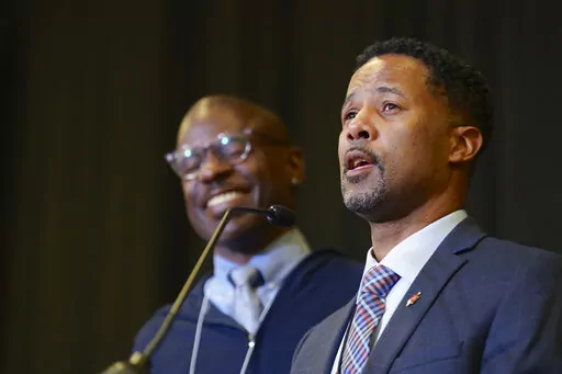 Bishop Cedrick Bridgeforth addresses the delegates, guests and his new episcopal colleagues, shortly after his election on Nov. 4, 2022, at Christ United Methodist Church in Salt Lake City. At left is his husband, Christopher Hucks-Ortiz. Bridgeforth is the first openly gay African-American man to be elected bishop. The vote comes six years after the Western Jurisdiction elected the denomination's first openly lesbian bishop, Karen Oliveto of the Mountain Sky Episcopal Area. (Patrick Scriven/Uni