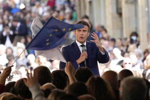 Centrist candidate and French President Emmanuel Macron speaks during a campaign rally Friday, April 22, 2022 in Figeac, southwestern France. Emmanuel Macron is facing off against far-right challenger Marine Le Pen in France's April 24 presidential runoff. (AP Photo/Christophe Ena)