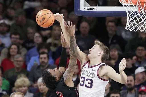 Gonzaga forward Ben Gregg (33) blocks a shot by Nicholls State guard Robert Brown III during the second half of an NCAA college basketball game, Wednesday, Dec. 18, 2024, in Spokane, Wash. (AP Photo/Young Kwak)