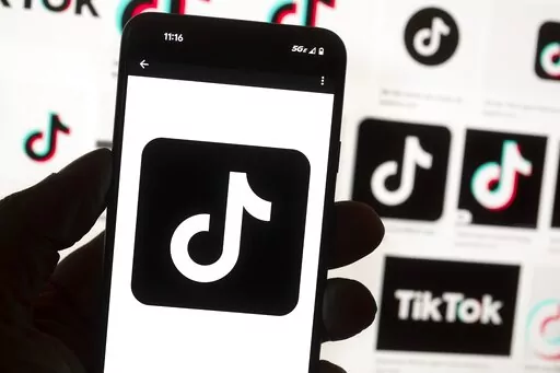 The TikTok logo is seen on a cell phone on Oct. 14, 2022, in Boston. On Thursday, Jan. 12, 2023, Wisconsin became the latest state to ban the use of TikTok on state phones and other devices, a move that comes amid a push for a federal ban and after nearly half of the states nationwide have blocked the popular app. (AP Photo/Michael Dwyer, File)