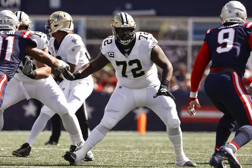 New Orleans Saints offensive tackle Terron Armstead looks to block against the New England Patriots during an NFL football game Sept. 26, 2021, in Foxborough, Mass. Armstead announced Tuesday night, March 22, that he’s signing with the Miami Dolphins. (AP Photo/Winslow Townson, File)