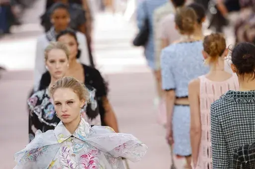 Models wear creations as part of the Chanel Spring/Summer 2025 collection presented Tuesday, Oct. 1, 2024, in Paris. (Photo by Vianney Le Caer/Invision/AP)