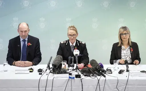 Professor Tim Atkins, Merseyside Police Chief Constable Serena Kennedy, and Dr Renu Bindra meet the press at Merseyside Police Headquarters, Liverpool, England, Tuesday, Oct. 29, 2024. Axel Rudakubana, 18, the teenager accused in a stabbing rampage that killed three girls at a Taylor Swift-themed dance class in England has been charged with producing the deadly poison ricin and faces a terror offense. (Danny Lawson/PA via AP)
