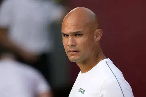 Baylor head coach Dave Aranda watches his team warm up before an NCAA college football game against Iowa State, Saturday, Oct. 5, 2024, in Ames, Iowa. (AP Photo/Charlie Neibergall, File)