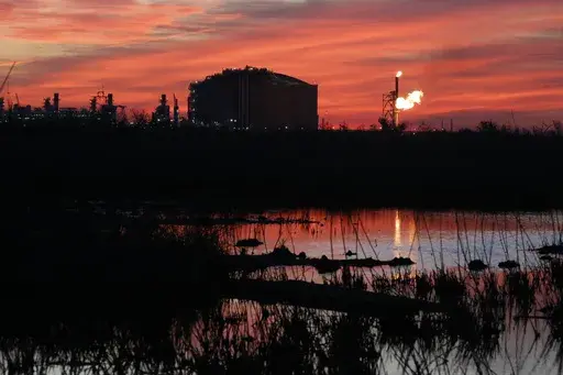 A flare burns at Venture Global LNG in Cameron, La., April 21, 2022. What would be the nation's largest export terminal for liquified natural gas won approval from a federal commission Thursday, June27, 2024 although when the southwest Louisiana project will be completed remains unclear in light of a Biden administration delay on such projects announced earlier this year. (AP Photo/Martha Irvine, File)