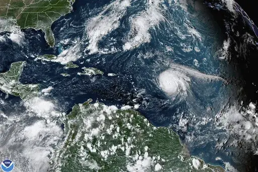 This satellite image provided by the National Oceanic and Atmospheric Administration shows Hurricane Sam, center right, in the Atlantic Ocean, Monday, Sept. 27, 2021, at 3:20 p.m. ET. On Tuesday, May 24, 2022, federal meteorologists say the Atlantic should expect another extra busy hurricane season in 2022. Tuesday's National Oceanic and Atmospheric Administration's Atlantic hurricane season forecast calls for 14 to 21 named storms, with six to 10 becoming hurricanes. (NOAA via AP, File)