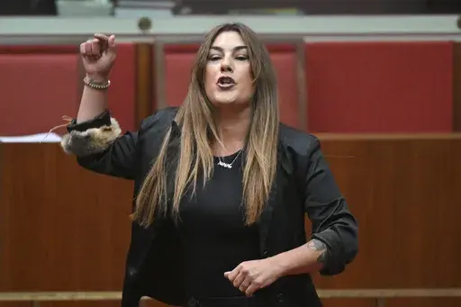 Australian Independent Sen. Lidia Thorpe gestures during a censure motion against her in the senate chamber at Parliament House in Canberra, Monday, Nov. 18, 2024. (Mick Tsikas/AAP Image via AP)