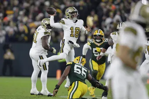 New Orleans Saints quarterback Spencer Rattler (18) passes during the second half of an NFL football game against the Green Bay Packers, Monday, Dec. 23, 2024, in Green Bay, Wis. (AP Photo/Matt Ludtke)