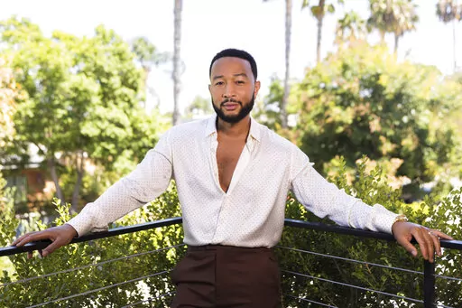 John Legend poses for a portrait on Monday, Aug. 15, 2022, in West Hollywood, Calif., to promote his latest double album "Legend." (Photo by Willy Sanjuan/Invision/AP)