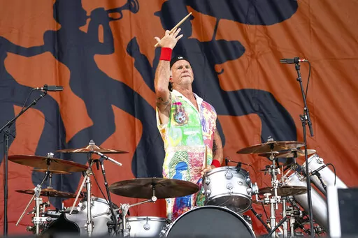 Chad Smith of the Red Hot Chili Peppers performs at the New Orleans Jazz and Heritage Festival, on Sunday, May 1, 2022, in New Orleans. (Photo by Amy Harris/Invision/AP)