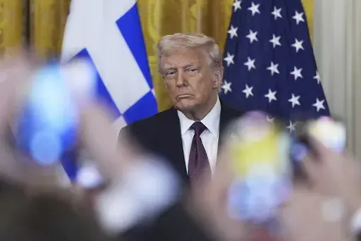 President Donald Trump attends a reception celebrating Greek Independence Day in the East Room of the White House, Monday, March 24, 2025, in Washington. (AP Photo/Mark Schiefelbein)